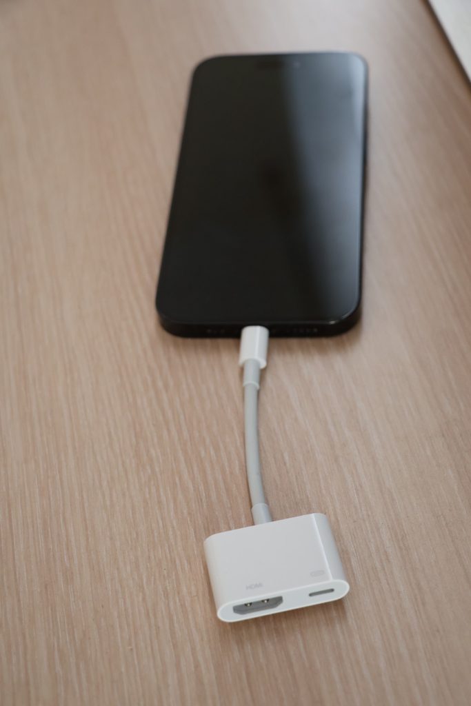 Connect the adapter to your iPhone’s lightning port