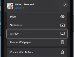 Tap on the AirPlay button in the Photos app on iPhone